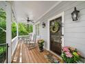 Inviting front porch with rocking chairs and potted flowers, perfect for enjoying the outdoors at 66 Mobile Ne Ave, Atlanta, GA 30305