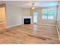 Bright and airy living room featuring hardwood floors, fireplace and access to the backyard at 4605 Fourth Rail Ln, Cumming, GA 30040