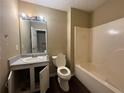 Bathroom with a single sink vanity, tile-surround bathtub-shower, and vinyl flooring at 554 Oak Landing Cir, Douglasville, GA 30134
