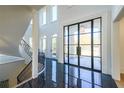 Spacious foyer boasting marble floors, soaring ceilings, and an elegant winding staircase at 2837 Darlington Run, Duluth, GA 30097