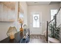 Inviting foyer with stylish decor, wood floors, and ample natural light at 130 Bingley Ct, Covington, GA 30016