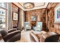 Comfortable living room featuring wood-paneled walls and elegant furnishings at 2440 Peachtree Nw Rd # 9, Atlanta, GA 30305