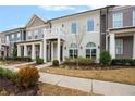 Beautiful townhouse with a balcony and well-manicured landscaping at 891 Proctor Oaks Nw St, Atlanta, GA 30318