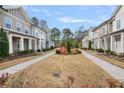 Neighborhood street view showcasing well-maintained townhouses and green spaces at 891 Proctor Oaks Nw St, Atlanta, GA 30318