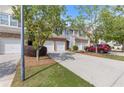 A lovely townhome with a two-car garage, brick features, and mature trees in a well-kept neighborhood at 2280 Baker Station Dr, Acworth, GA 30101