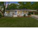 Charming renovated home featuring a freshly painted exterior and well-manicured lawn at 2385 Perkerson Sw Rd, Atlanta, GA 30315