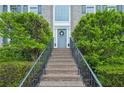 Inviting brick entryway with decorative wreath leading to the home's front door at 2987 Windward Nw Dr, Kennesaw, GA 30152