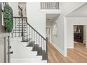 Bright foyer with hardwood floors, staircase, and neutral paint at 2987 Windward Nw Dr, Kennesaw, GA 30152