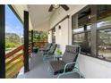 Relaxing covered porch with comfortable seating and view of the yard at 3412 Collier Nw Dr, Atlanta, GA 30331