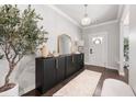 Elegant entryway features stylish console table, decorative mirror, and a welcoming ambiance at 1452 Weatherbrook Cir, Lawrenceville, GA 30043