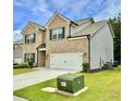 Attractive two-story home with brick accents, green lawn, and a convenient two-car garage at 1452 Weatherbrook Cir, Lawrenceville, GA 30043
