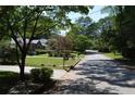 Residential street view with mature trees and well-maintained lawns at 2381 Eastway Rd, Decatur, GA 30033
