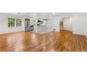 Spacious living room boasts hardwood floors and an open layout with a view into the modern kitchen at 2702 Galaxy Ct, Decatur, GA 30034
