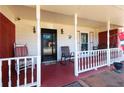 Inviting front porch with a swing and seating, perfect for relaxing outdoors at 1830 Brandy Se Ln, Conyers, GA 30013