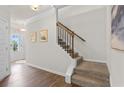 Carpeted staircase featuring hardwood accents and leading to the upper level of the home at 295 Cranston Dr, Canton, GA 30114