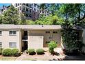 Apartment building featuring brick facade and landscaped grounds at 311 Peachtree Hills Ne Ave # 10C, Atlanta, GA 30305