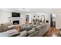 Comfortable living room with a fireplace, neutral colors, and an open layout at 1384 Sunrise Way, Lawrenceville, GA 30046