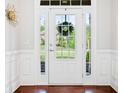 Bright entryway with a stylish white door, sidelights, and beautiful molding at 3230 Sundew Nw Dr, Acworth, GA 30101