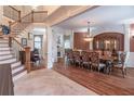 Grand dining room featuring hardwood floors, chandelier lighting, and staircase access at 1584 Water Springs Way, Dacula, GA 30019