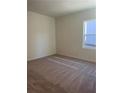 Bright bedroom with plush carpeting and a window at 7785 Sudbury Cir, Covington, GA 30014