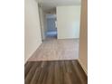 Inviting living room featuring hardwood floors and neutral paint at 7785 Sudbury Cir, Covington, GA 30014