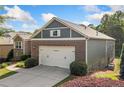 Well-maintained home with a two-car garage, neat landscaping and a driveway at 120 Laurel Rdg, Canton, GA 30114