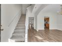 Bright entryway featuring hardwood floors, stairway and open access to other rooms at 621 Kenridge Way # 0, Suwanee, GA 30024