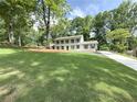 Beautiful two-story home with painted brick exterior, balcony, on a landscaped front yard at 1892 Mercedes Ne Ct, Atlanta, GA 30345