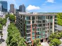 Upscale condominium with multiple balconies and large windows, with plenty of mature trees at 905 Juniper Ne St # 808, Atlanta, GA 30309