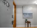 Hallway featuring unit number with neutral paint and updated security door hardware at 130 26Th Nw St # 415, Atlanta, GA 30309