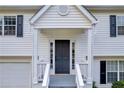 Welcoming front entrance of a two-story home with black door and white trim at 1645 Cobbs Creek Ln, Decatur, GA 30032