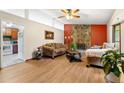 Cozy living room features a stone fireplace, hardwood floors and neutral-toned furniture at 273 Hardwood Ln, Lawrenceville, GA 30044