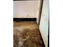 A room with water damage, missing baseboards, and damaged floors at 401 Camelot Dr, Atlanta, GA 30349