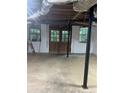 Unfinished basement with windows and double door access to outside at 618 Old Doss Dr, Canton, GA 30115