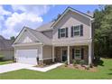 Attractive home showcasing stone accents, complemented by a manicured lawn and lush greenery, creating a welcoming curb appeal at 48 Beaver Pt, Villa Rica, GA 30180