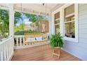 Inviting front porch featuring a porch swing and views of the landscaped neighborhood at 34 Clifton Se St, Atlanta, GA 30317