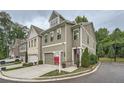 Corner lot property with a two-car garage, manicured lawn, and sidewalk access at 351 Gaines St, Marietta, GA 30060