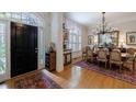Elegant dining room featuring hardwood floors, natural light, and a chandelier at 4470 Crestwicke Pointe, Atlanta, GA 30319