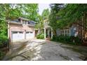 Beautiful brick home featuring a two-car garage, a covered entrance, and a spacious driveway at 4470 Crestwicke Pointe, Atlanta, GA 30319