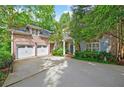 Charming brick home with a two-car garage and beautifully landscaped yard, set in a lush, green environment at 4470 Crestwicke Pointe, Atlanta, GA 30319
