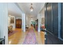 Inviting foyer with hardwood floors, elegant lighting, and an open view into the living spaces at 4470 Crestwicke Pointe, Atlanta, GA 30319