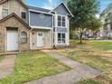 Charming two-story home featuring blue siding and white trim with a beautifully landscaped lawn at 845 Heritage Dr, Stone Mountain, GA 30088