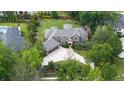 Aerial view of large brick home with sprawling backyard, mature trees, manicured landscaping, and long driveway at 22 Mount Paran Rd, Atlanta, GA 30327