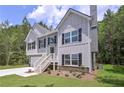 View of the side exterior showcasing the home's architectural details and landscaping at 48 Deer Pl, Villa Rica, GA 30180
