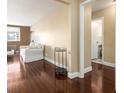Inviting hallway with rich hardwood floors leading to a bright living space and a conveniently located bathroom at 215 Piedmont Ne Ave # 507, Atlanta, GA 30308