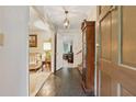 Welcoming foyer featuring tile flooring, chandelier, and views into adjacent living spaces at 2255 Chippewa Dr, Riverdale, GA 30296