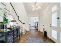 Bright foyer featuring a staircase and hardwood floors, and decorative chest with accents at 3382 Habersham Rd, Atlanta, GA 30305