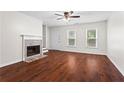 Bright living room with fireplace and hardwood floors at 4108 Gray Birch Ln, Duluth, GA 30096