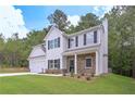 Beautiful two-story house with stone accents, a well-maintained lawn, and mature landscaping at 16 Deer Place, Villa Rica, GA 30180