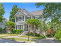 Attractive two-story home with meticulously landscaped yard and charming front porch at 1974 Mason Mill Rd, Decatur, GA 30033